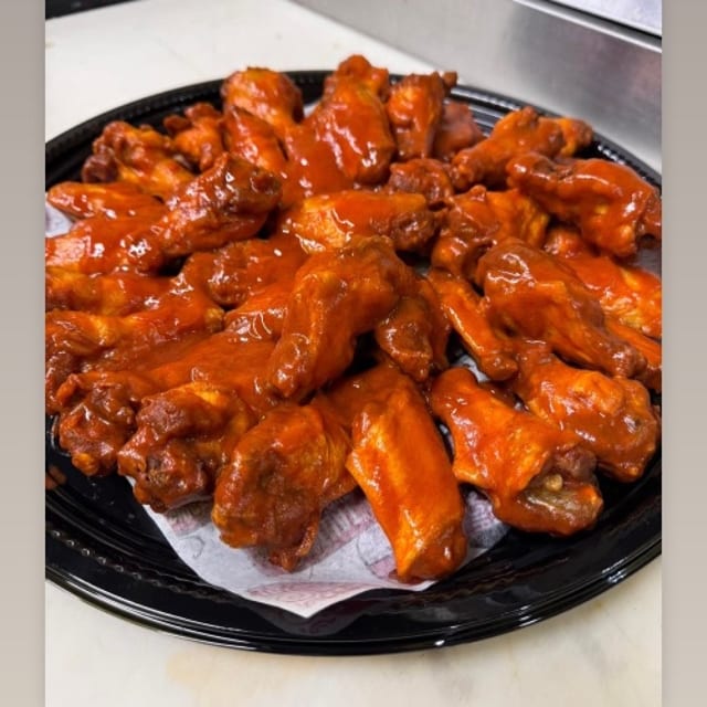 50 Wings (Up to 5 flavors).
