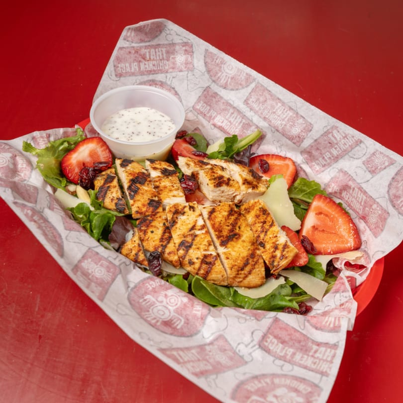 That Chicken Place grilled chicken salad with strawberries, cheese, and poppy seed dressing.